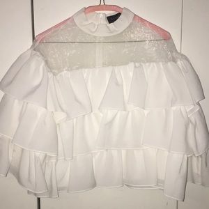 A white ruffle shirt.